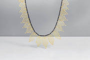Todd Reed necklace with White brilliant cut diamonds(~2.42ct), 18k yellow gold, and sterling silver with patina.